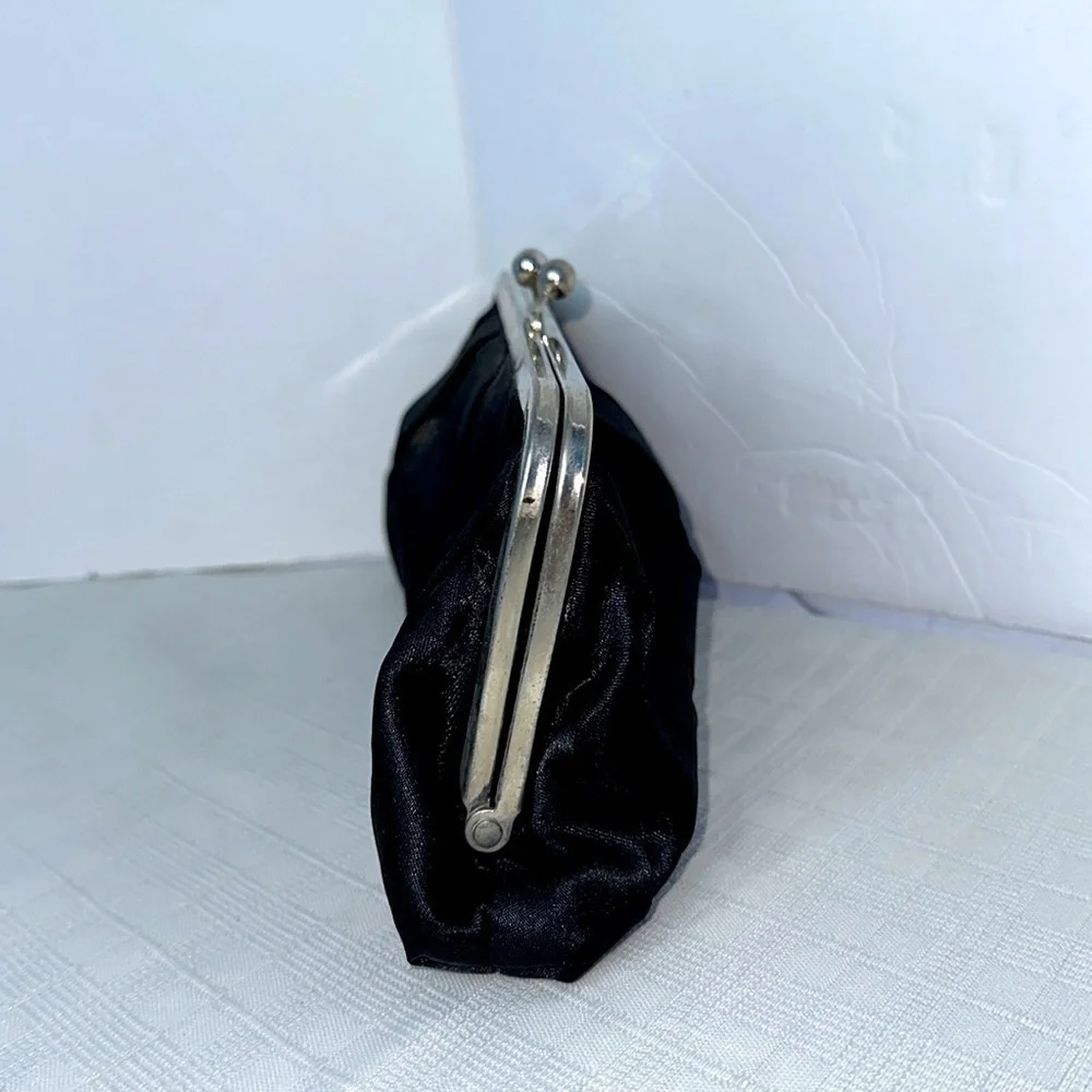 Carolina Herrera kiss lock black and silver clutch